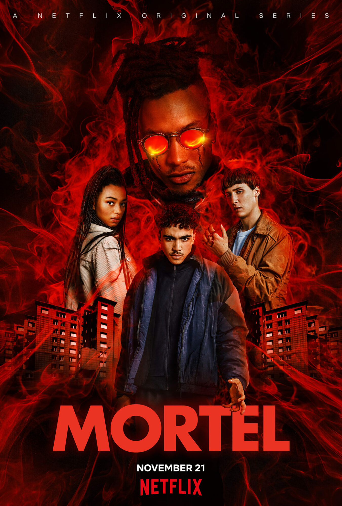 Four characters stand in front of a fiery background with red smoke, with the title 'MORTEL' and release date.