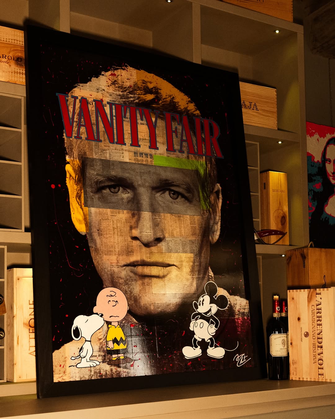 Vanity Fair magazine cover featuring a black-and-white portrait of a man with cartoon characters Snoopy and Mickey Mouse at the bottom.