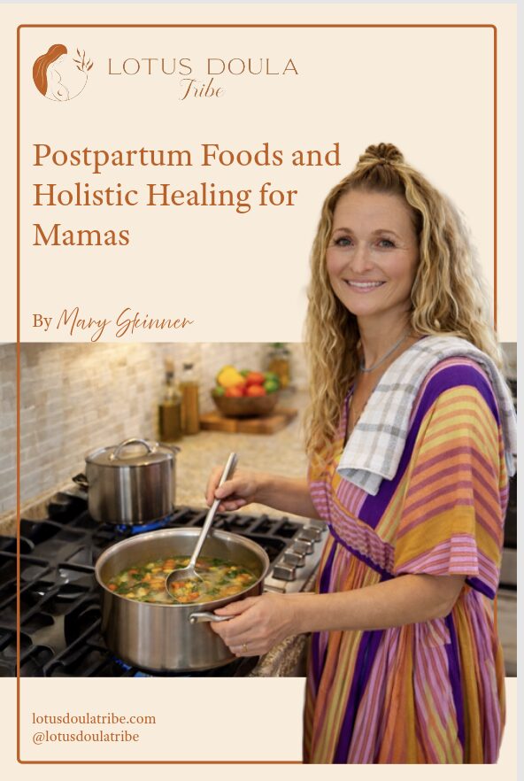 Woman with curly hair cooking in a kitchen, wearing a colorful striped dress and smiling.