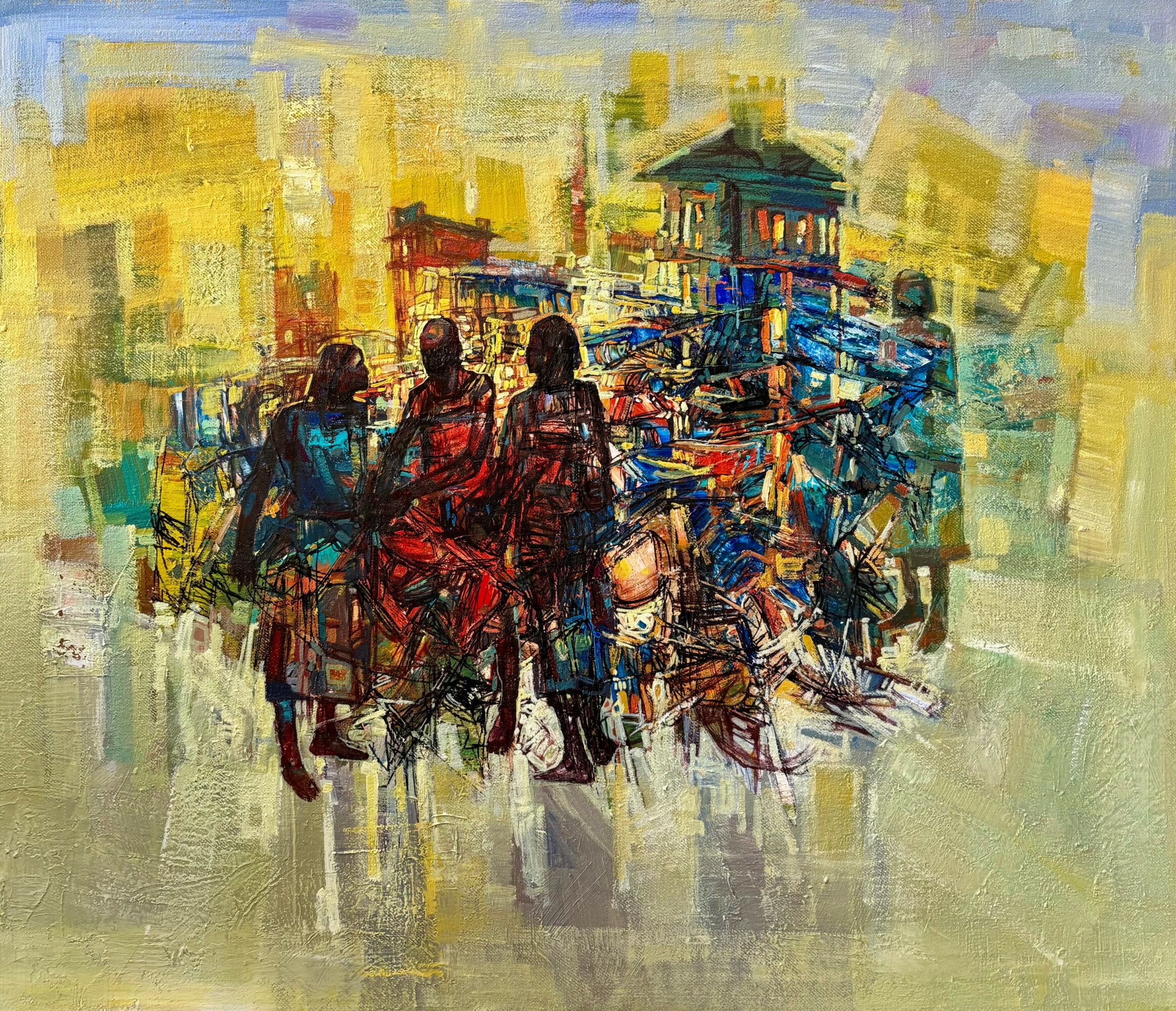Group of people sitting outdoors with colorful background and a building in the distance.