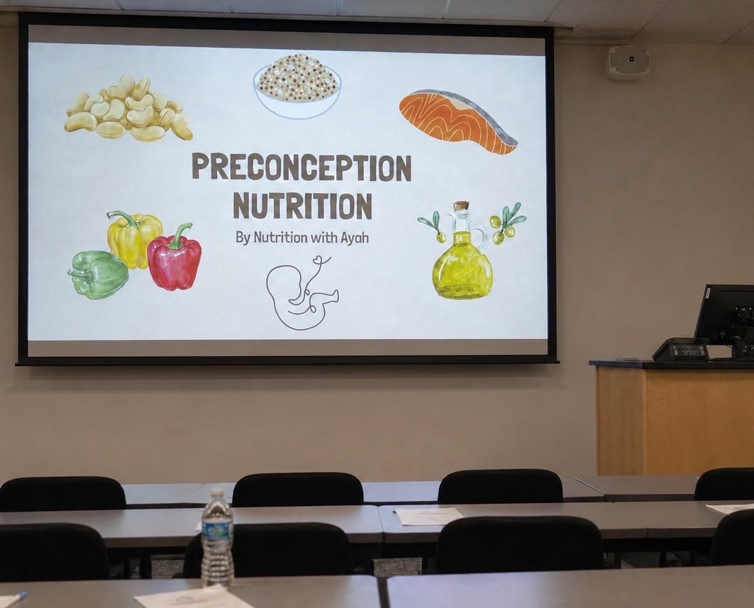 Presentation slide titled 'Preconception Nutrition' with images of vegetables, grains, salmon, olive oil, and a pregnant woman icon.