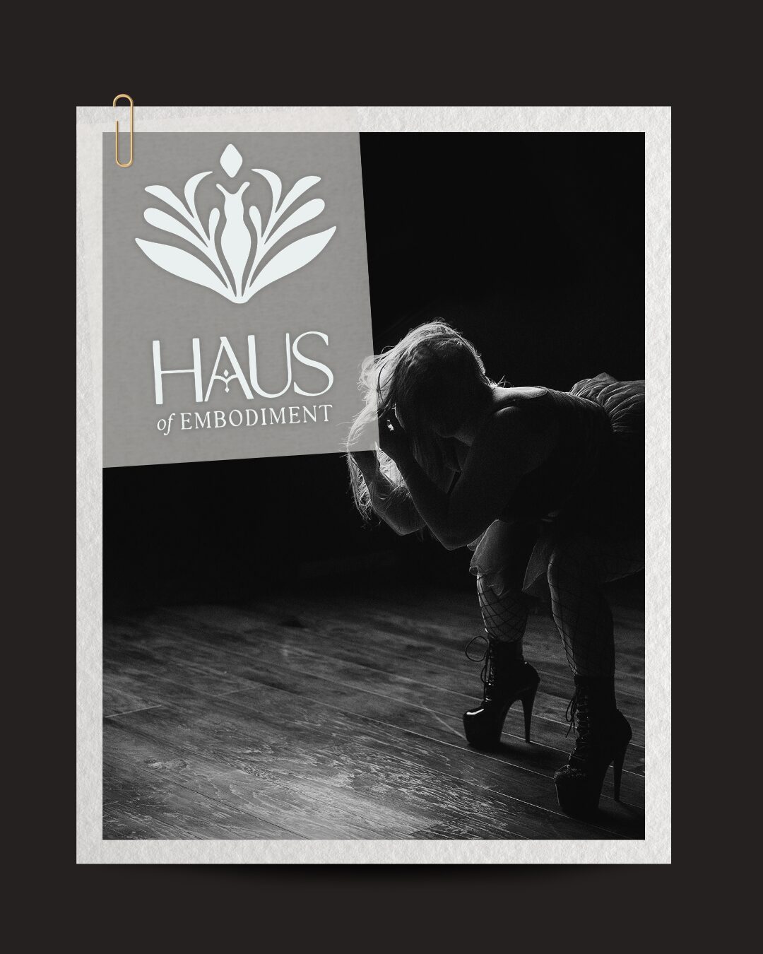 Person bending down on a wooden floor with a logo and text on a screen in the background.