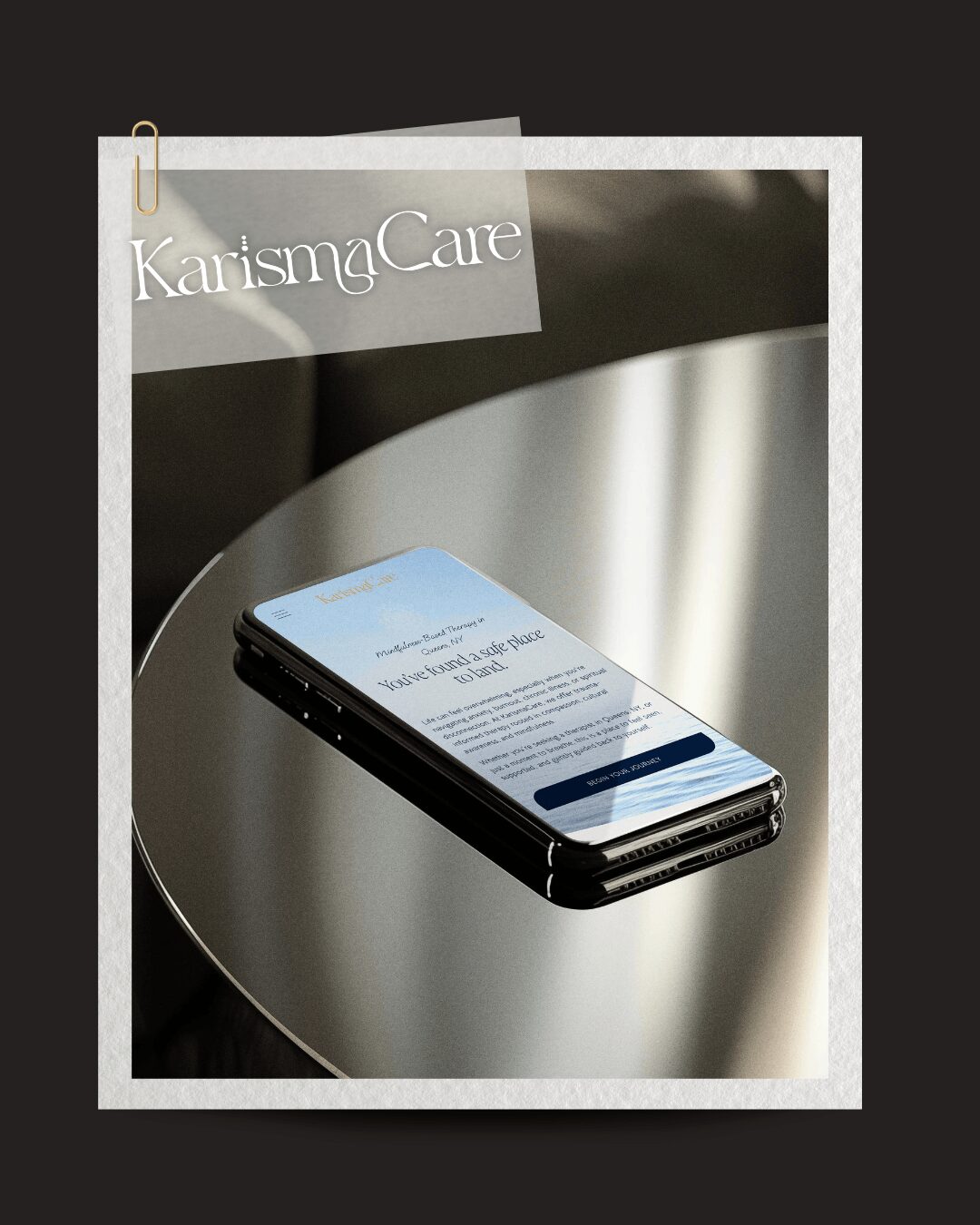 Smartphone on a reflective surface with a KarismaCare sign in the background, viewed from the side. Word count: 20.