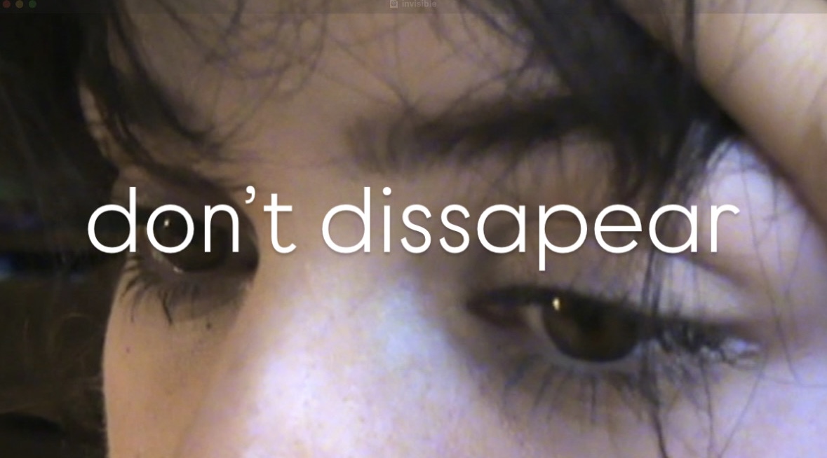 Close-up of a person's eye with text saying 'don't disappear'.