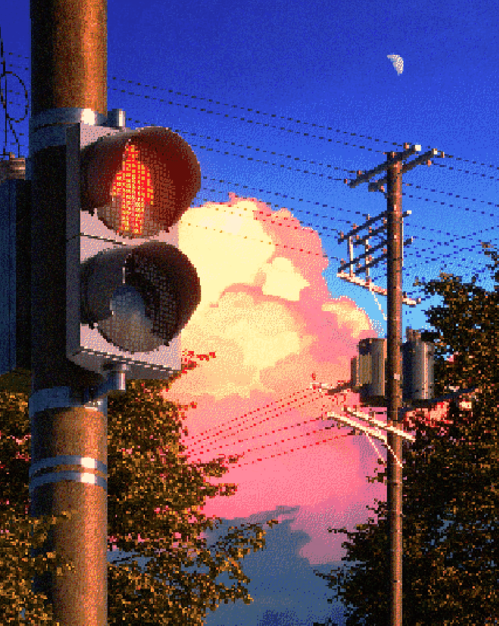 Traffic light with red and green signals, sky with pink clouds, moon, and utility poles with wires, trees in background.