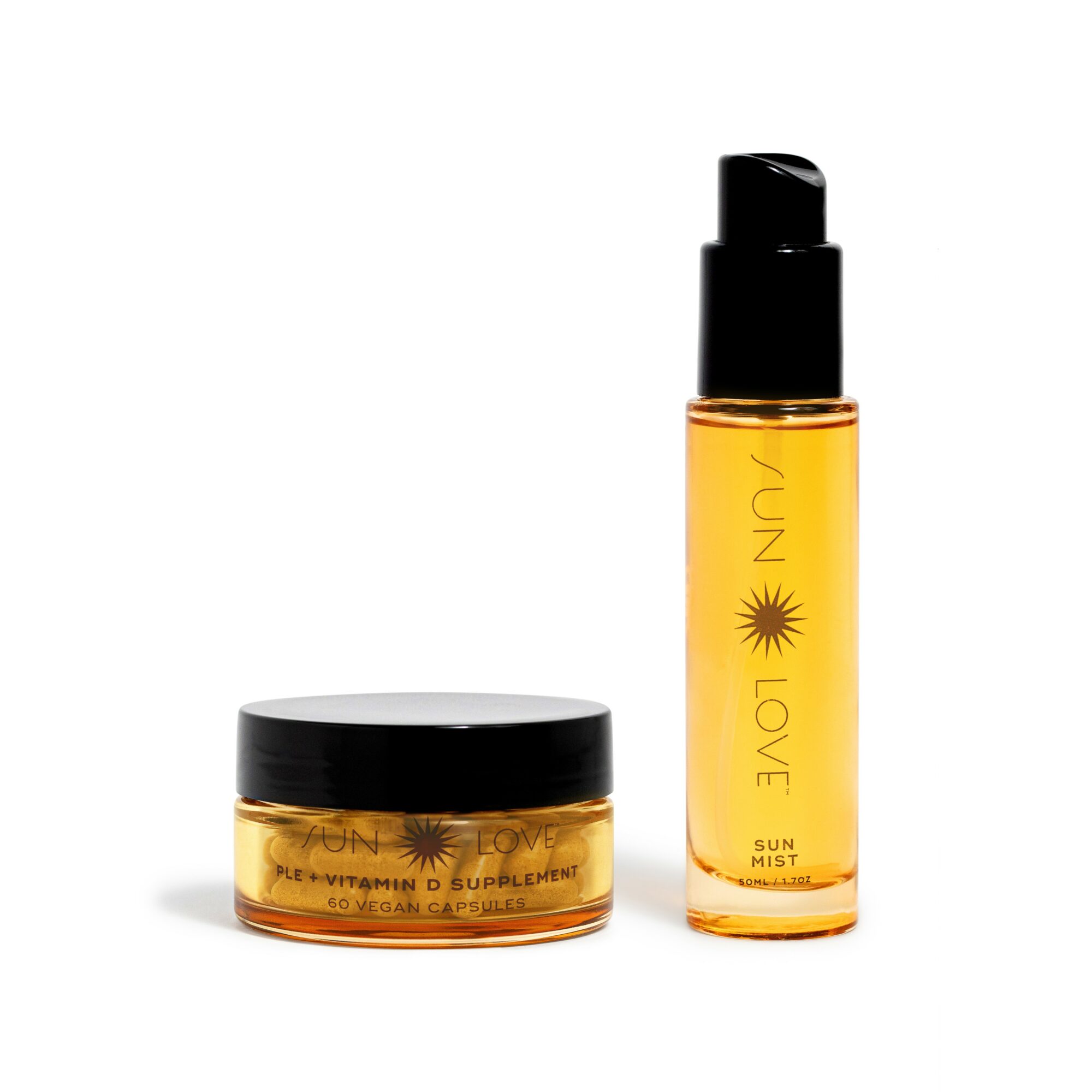Two skincare products, a jar and a spray bottle, with black caps and yellow-orange labels, on a white background.
