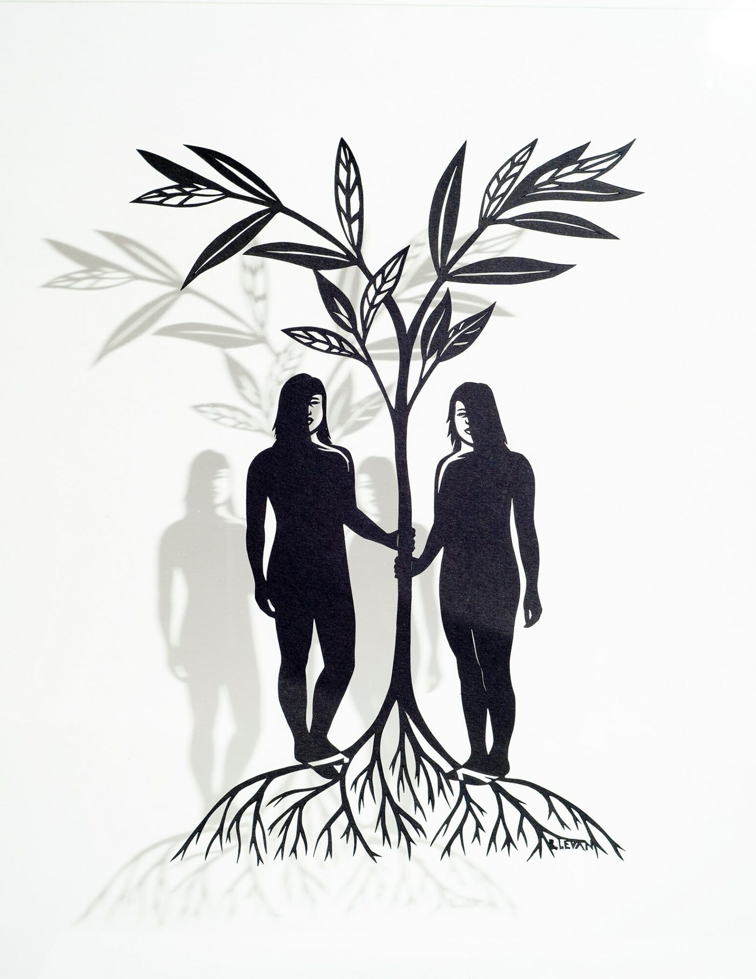Silhouettes of a man and woman holding hands under a large plant with roots, leaves, and shadowed figures in the background.