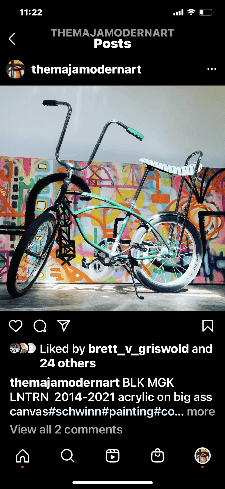 Bicycle with a colorful graffiti background, white seat, and black handlebars, leaning against a wall. Bright and artistic scene.