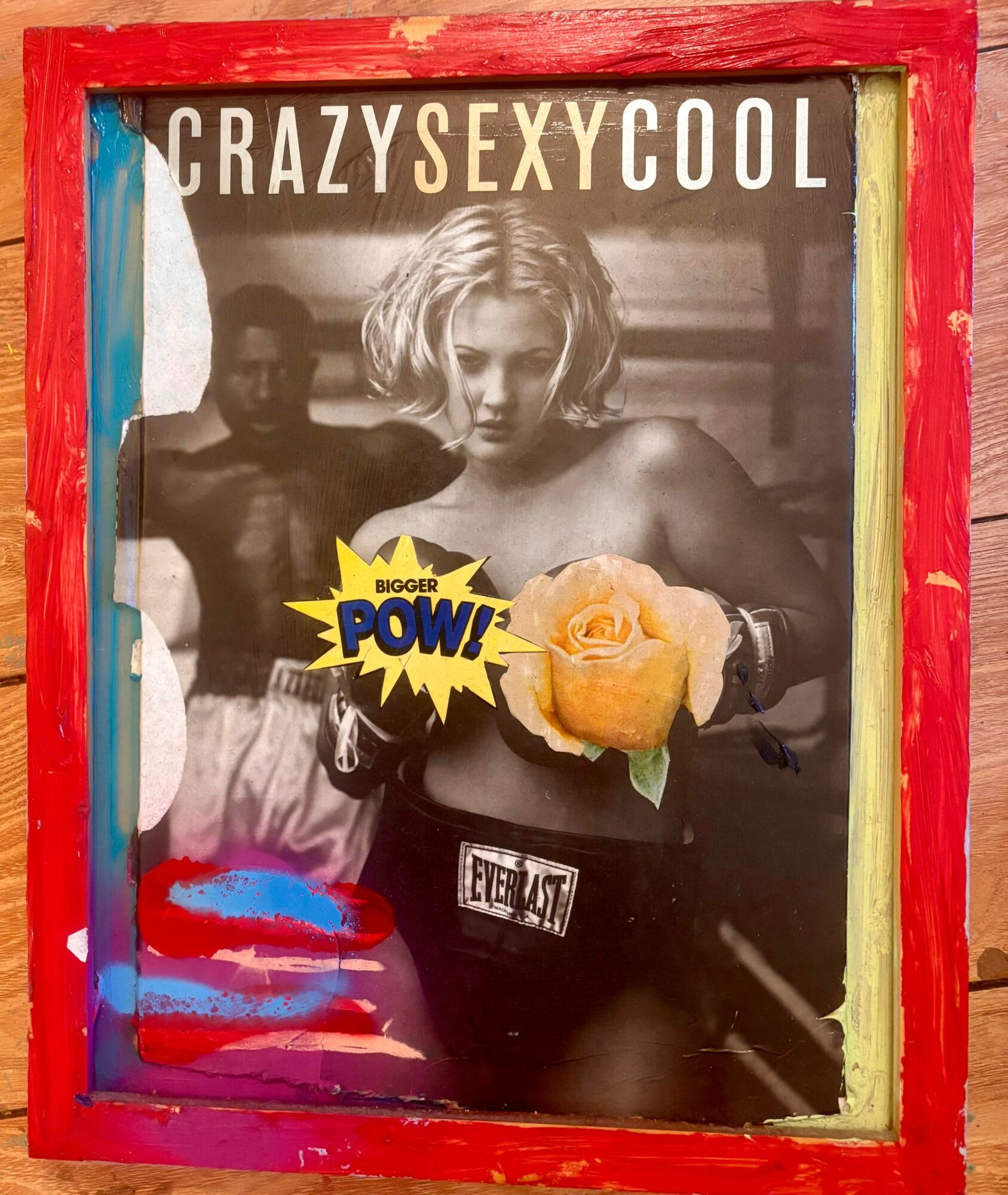 Black and white photo of a woman holding a yellow rose, with colorful painted frame, and text reading 'CRAZY SEXY COOL'.