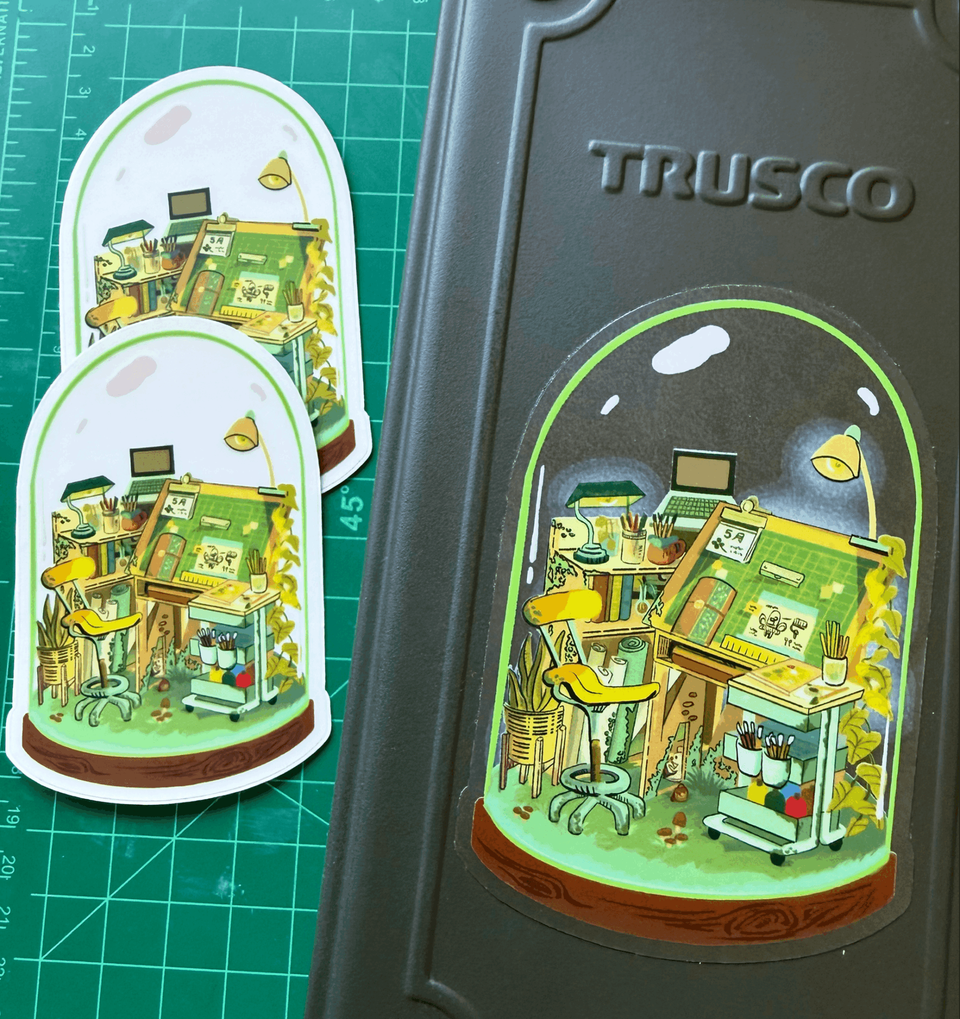 Colorful illustration of a house with plants, furniture, and animals inside a glass dome, on a Trusco toolbox.