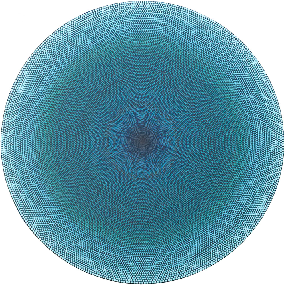 A circular pattern with a gradient of blue shades, from dark in the center to lighter at the edges.
