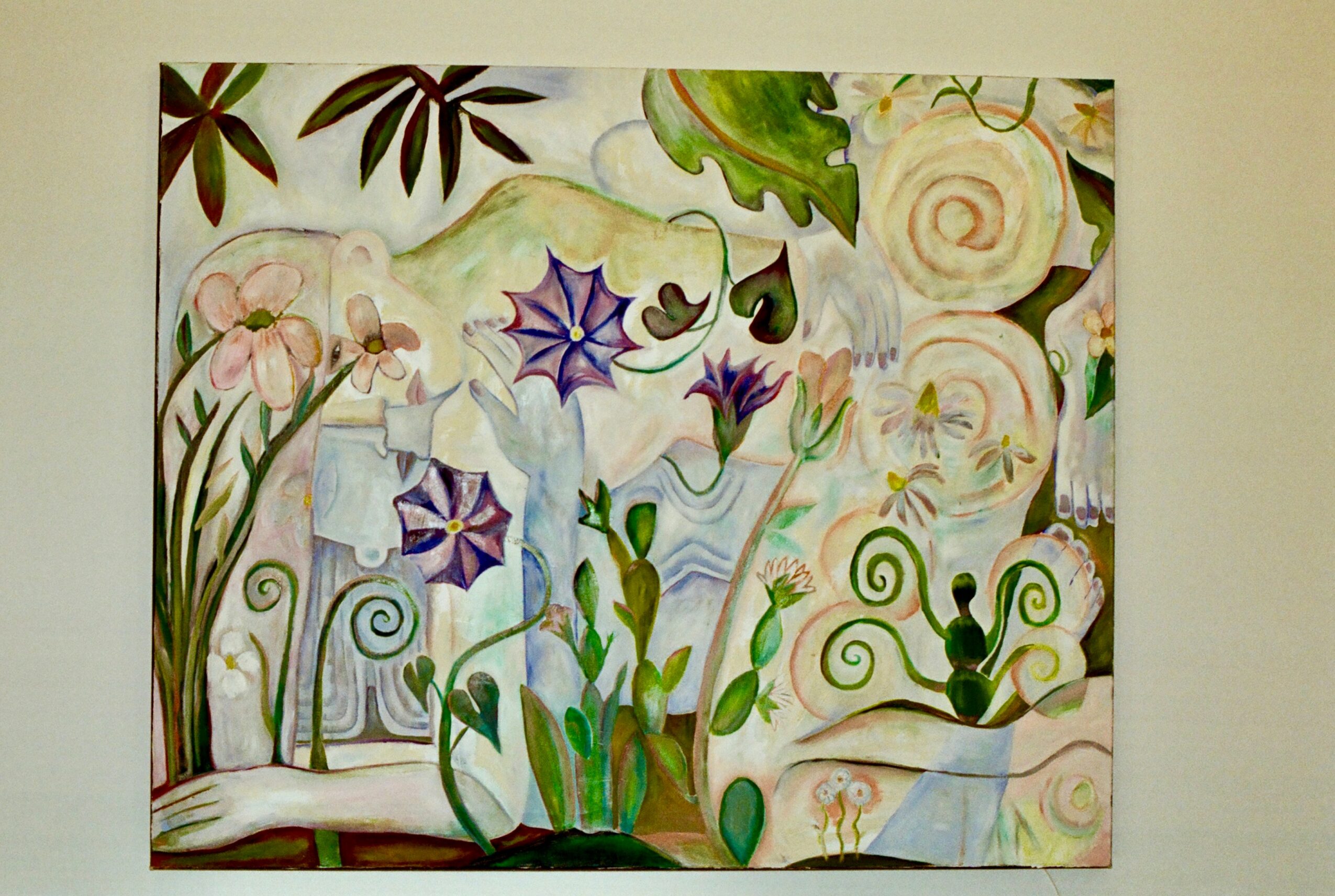 Colorful abstract painting with flowers, leaves, and swirling patterns on a light background.