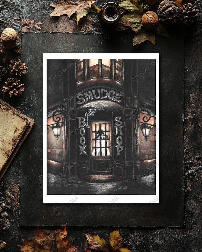 Dark entrance to a bookstore and shop with a sign reading 'SMUDGE' above the door, flanked by two lanterns.
