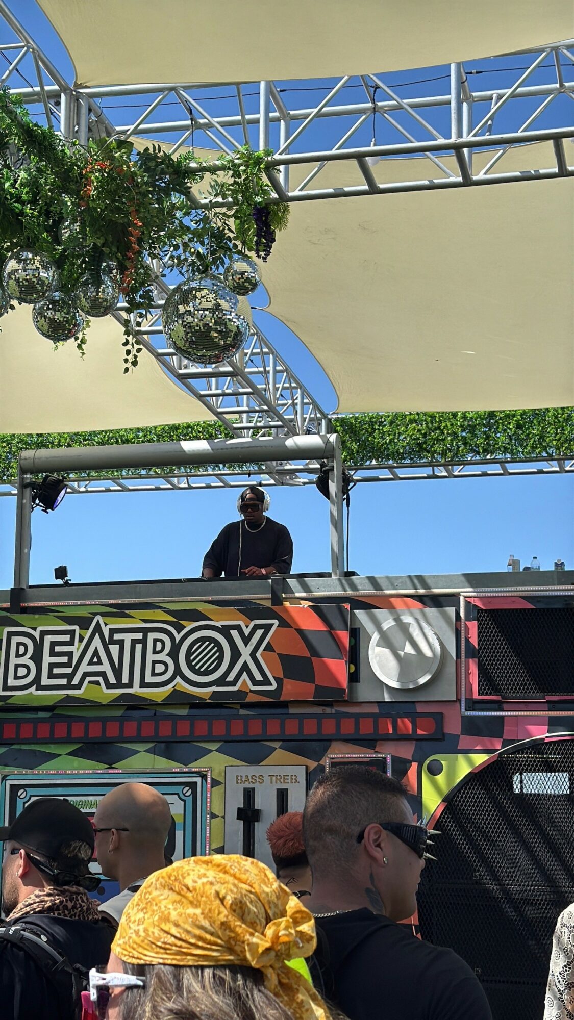 Person DJing on a stage with a