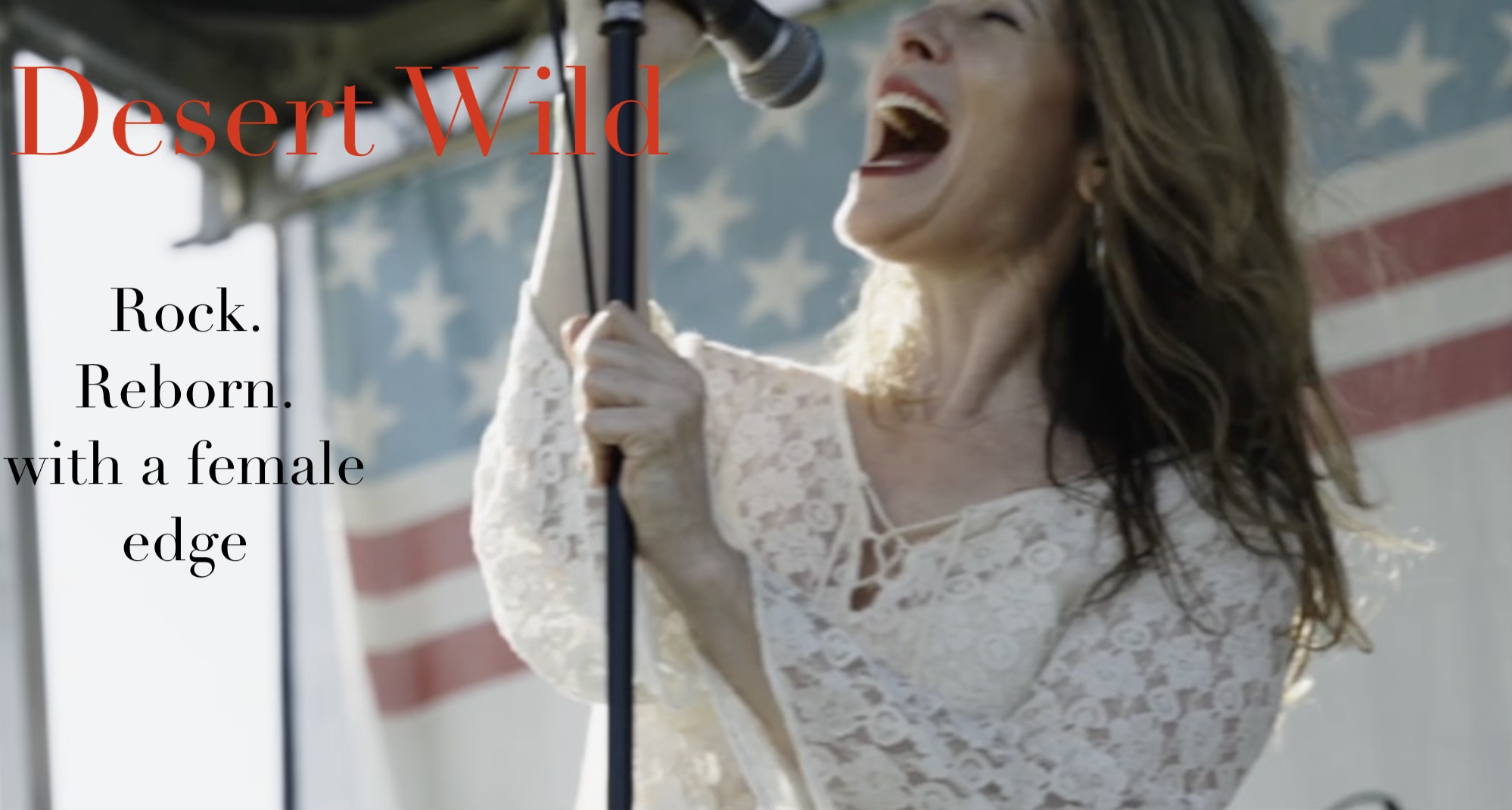 Woman singing into microphone with American flag background, wearing white lace dress, smiling, text reads 'Desert Wild' and 'Rock. Reborn.'