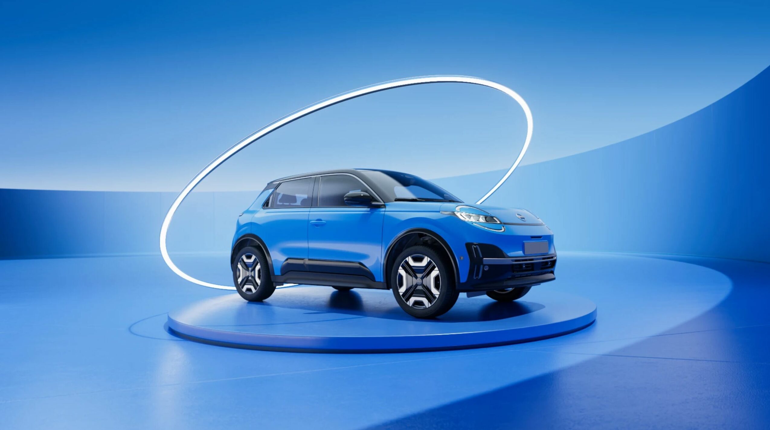 Blue compact SUV on a circular platform with a glowing ring overhead, set against a blue background.