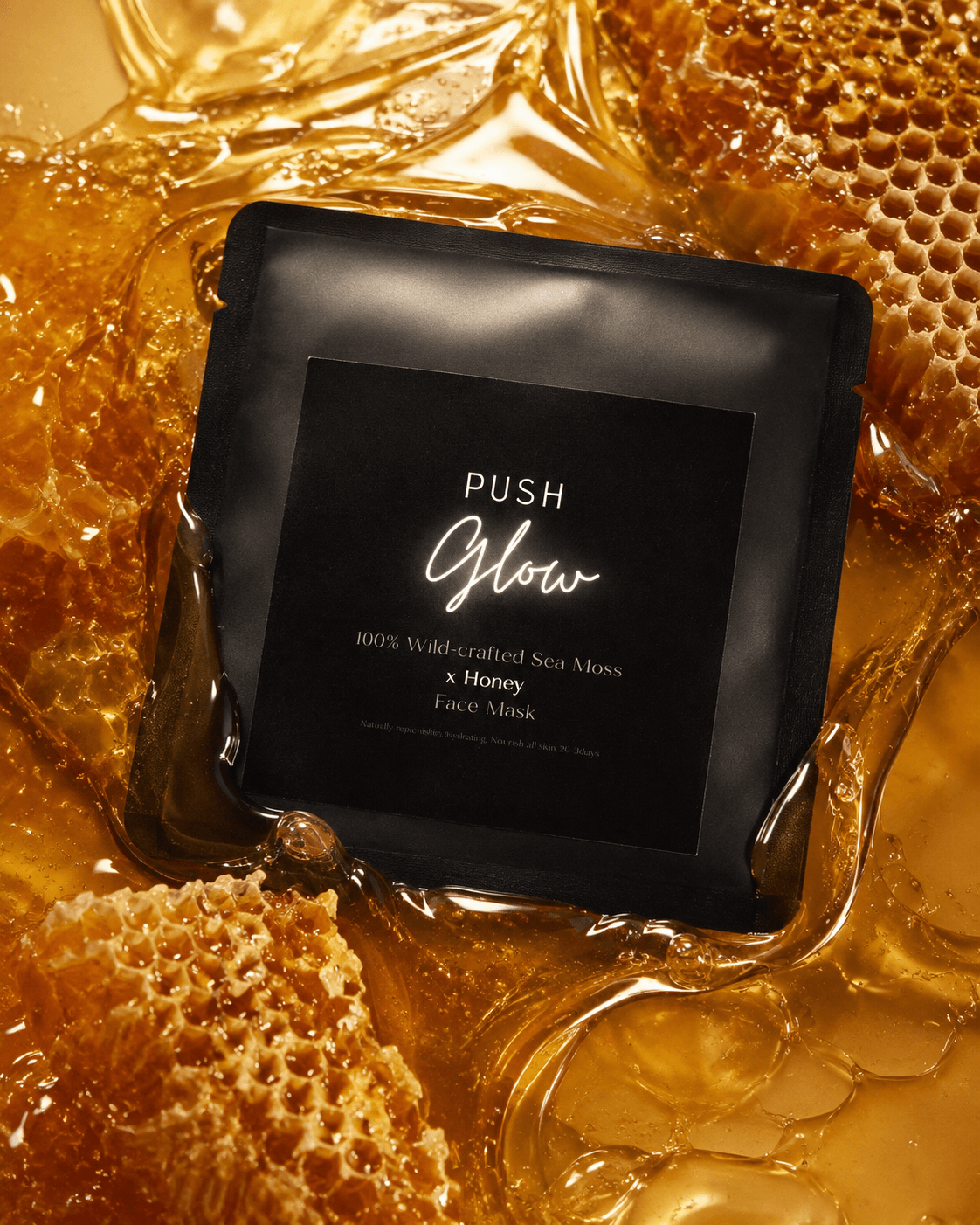 Black square container labeled 'Push Glow' surrounded by honey and honeycomb pieces, with honey dripping around.