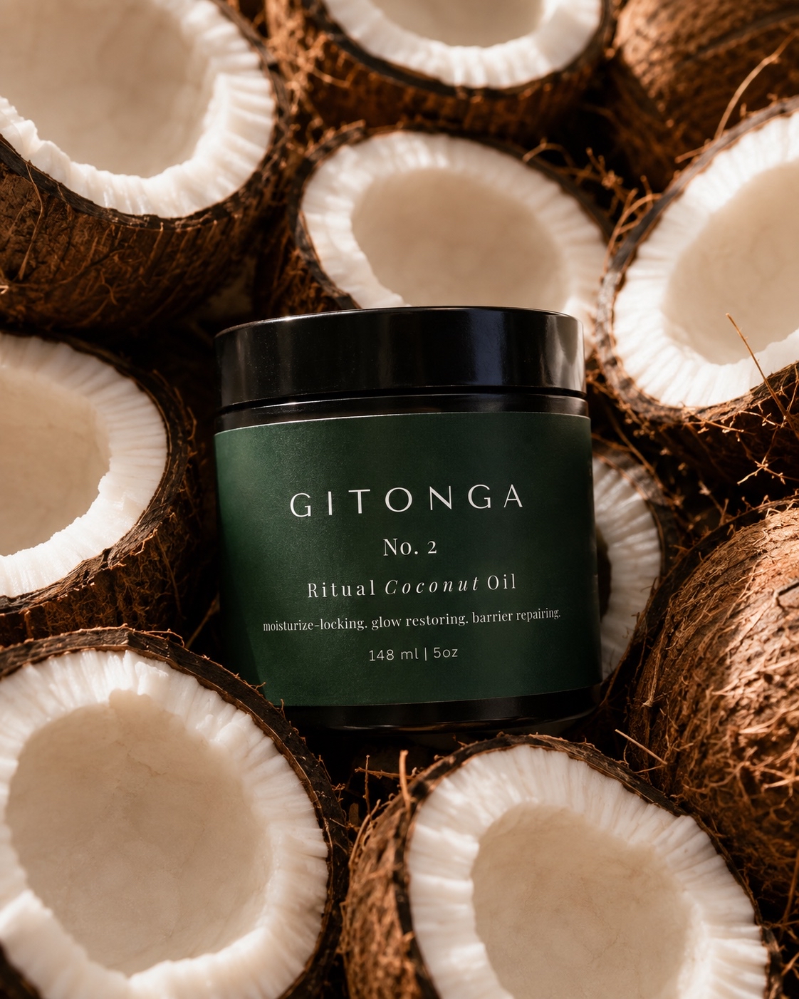 Container of Gitonga Ritual Coconut Oil surrounded by halved coconuts, showing white flesh and brown shells.