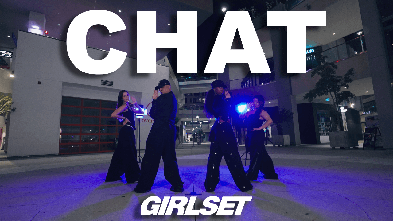 Four people stand in a circle at night with blue lights, with large white text reading 'CHAT' and smaller text 'GIRLSET'.