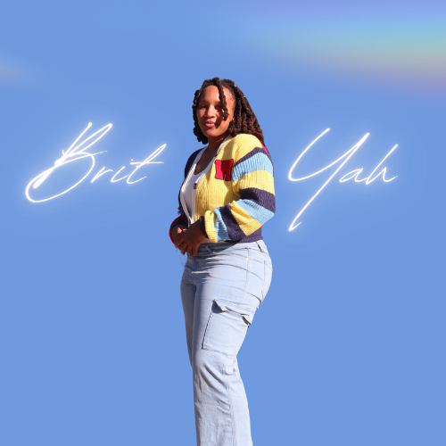 A woman with curly hair stands against a blue background with neon text reading 'Brit Yuh'.