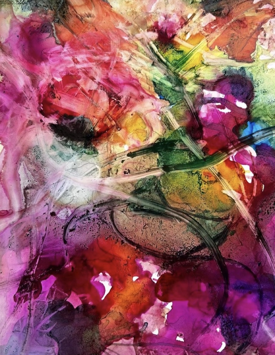 Abstract watercolor painting with pink, red, orange, green, yellow, purple, and blue colors blending and splashing.