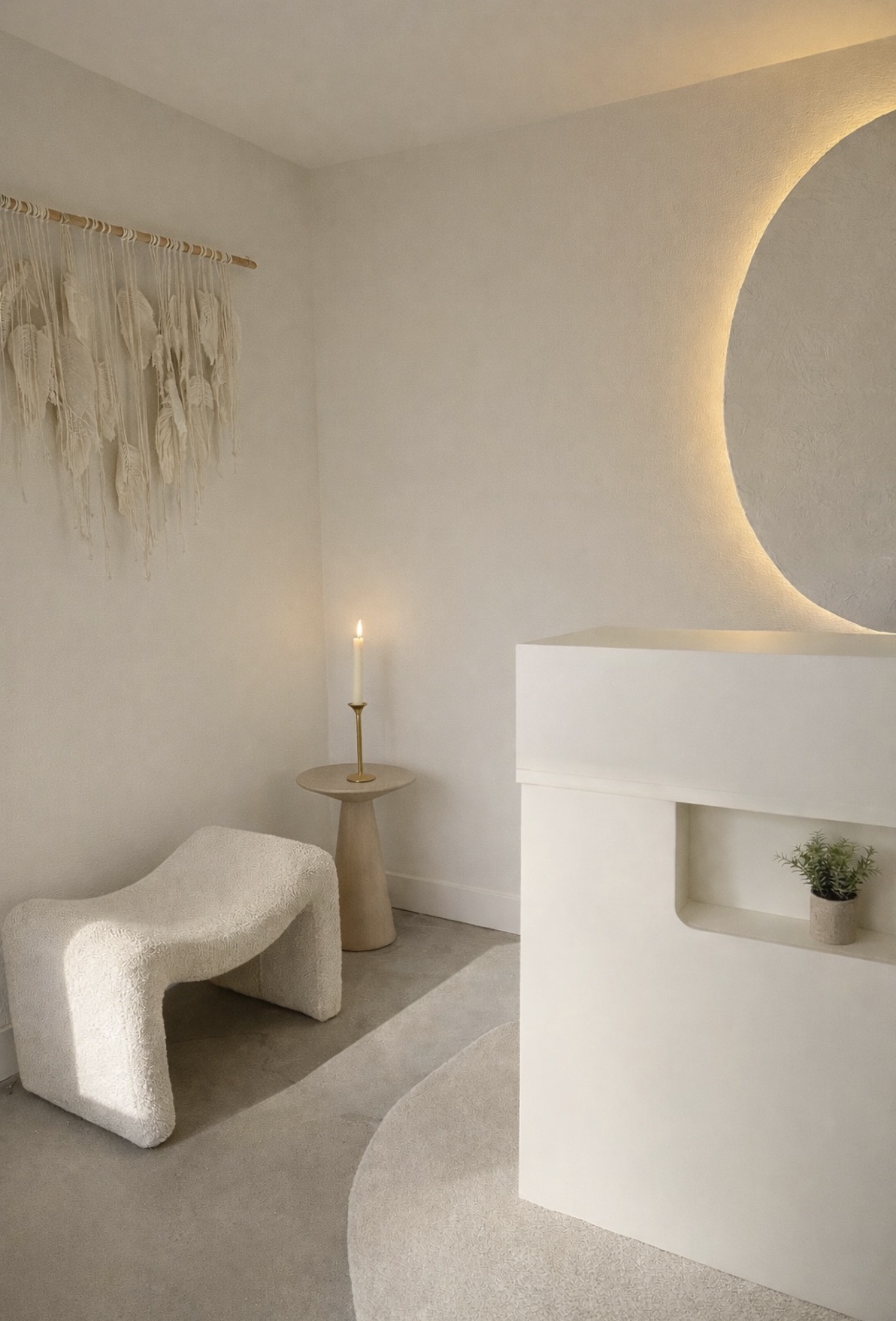 Minimalist interior with a white curved wall, small bench, and a lit candle on a side table, soft lighting, neutral tones.