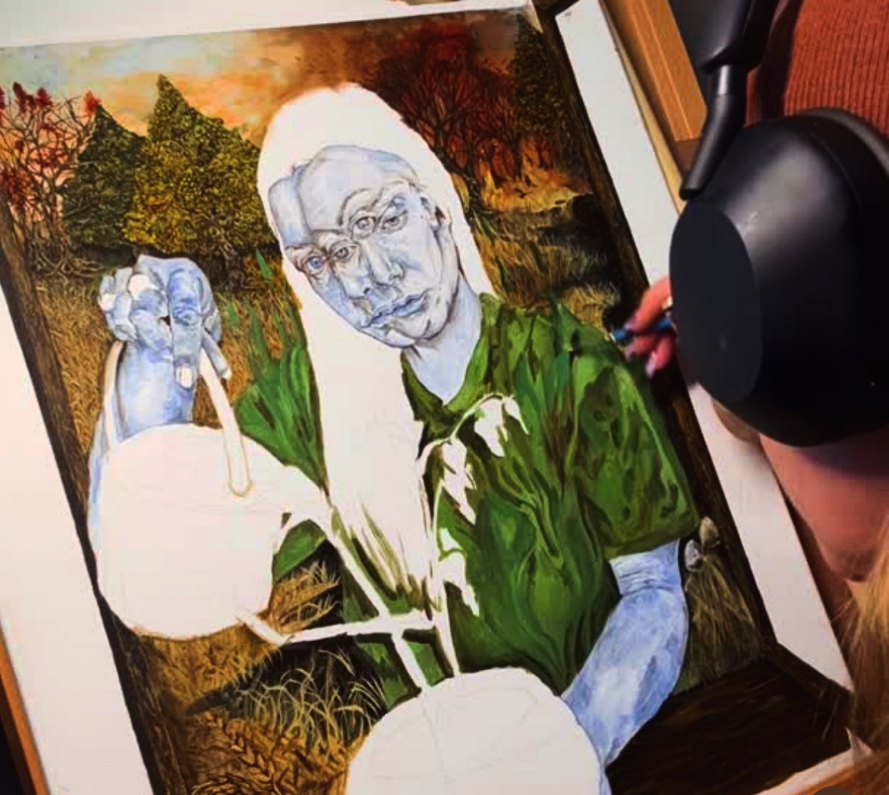Person painting a portrait of an elderly woman outdoors with trees and sky in background.