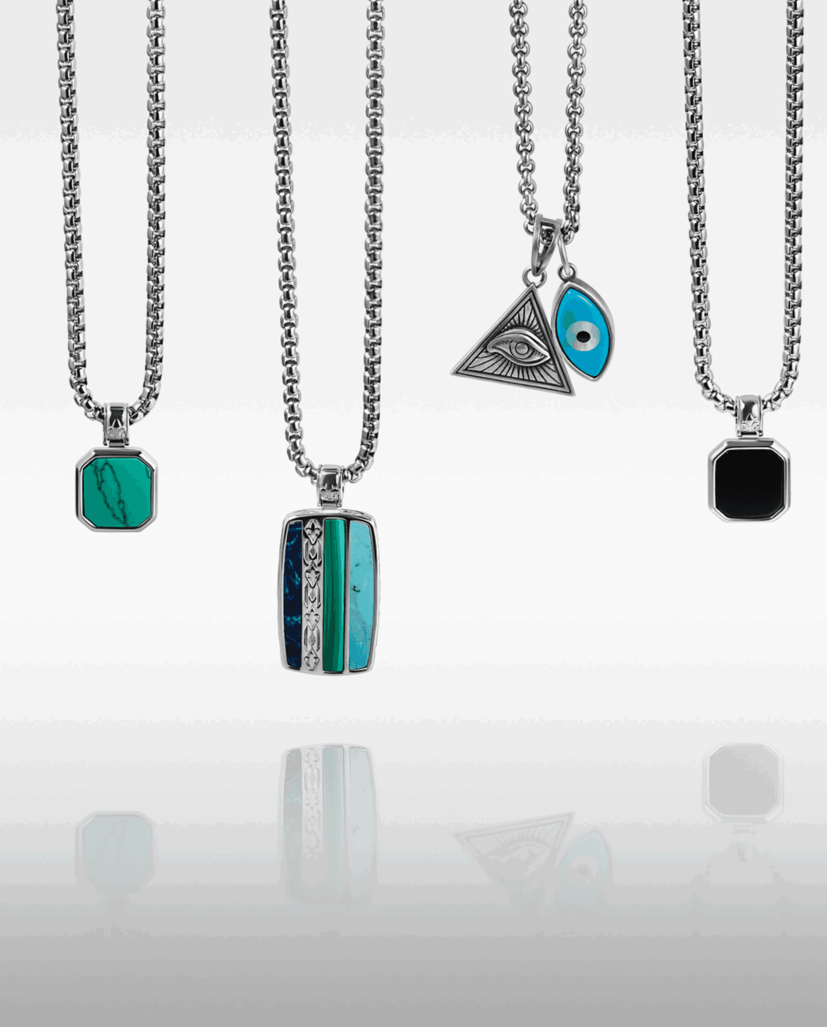 Four necklaces with various pendant designs, including geometric shapes and eye motifs, hanging against a white background.