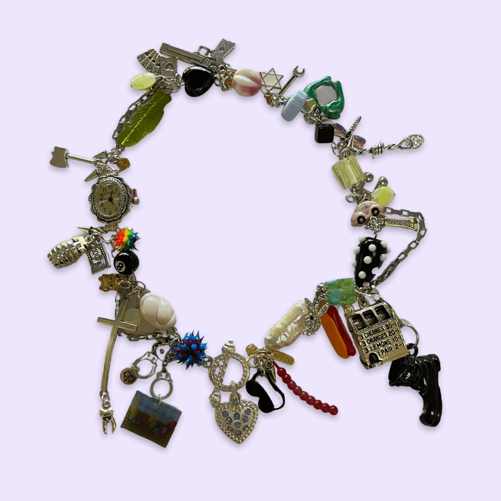 Bracelet with various charms including a gun, a cross, a shoe, a lock, and a heart, on a light purple background.