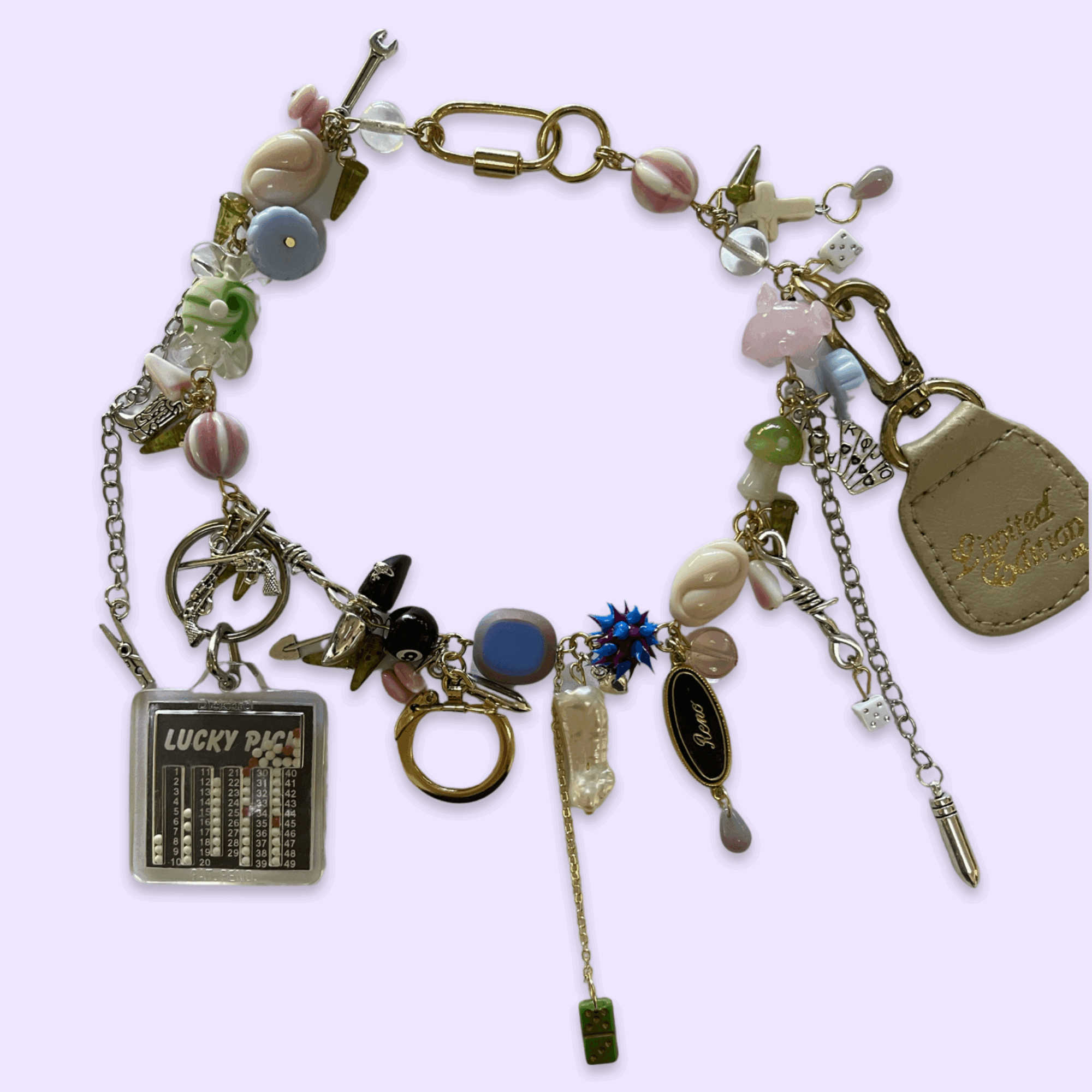 Colorful charm bracelet with various beads, charms, and a small Lucky Pack display, on a light purple background.