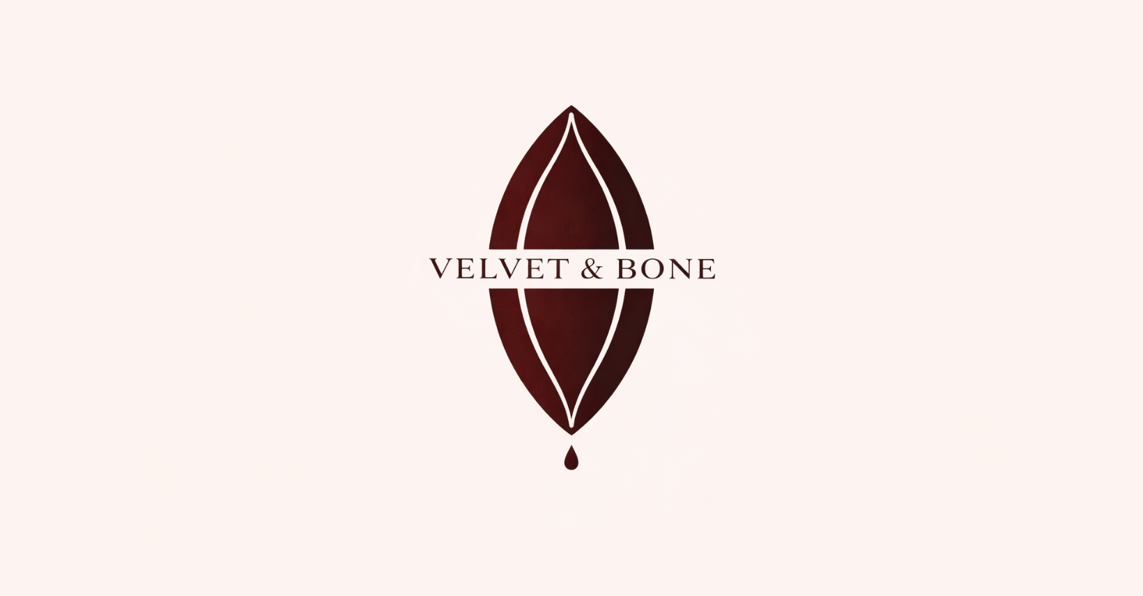 A logo with a dark brown leaf shape and the text 'Velvet & Bone' in the center.