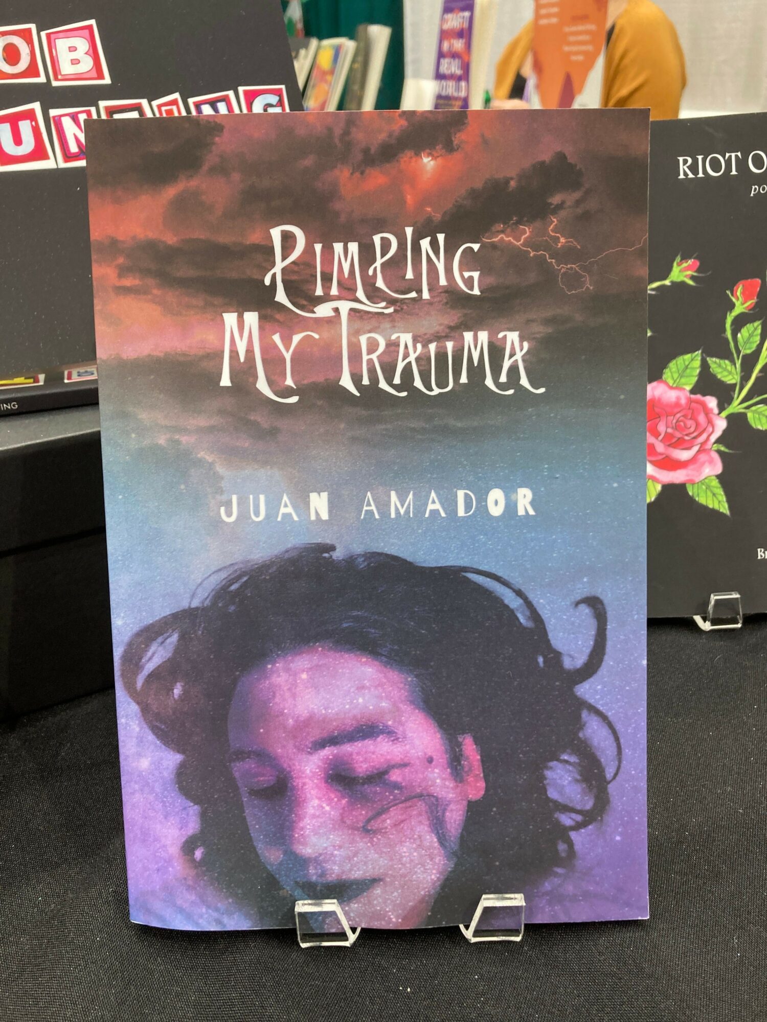 Book cover with a woman's face, dark hair, and a purple background, titled 'Daring My Tranquil' by Julia Amor.