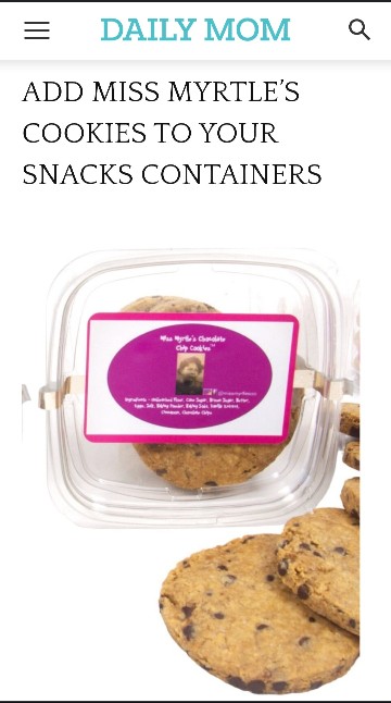 Cookies in a clear container with a pink label, partially visible, on a white background.