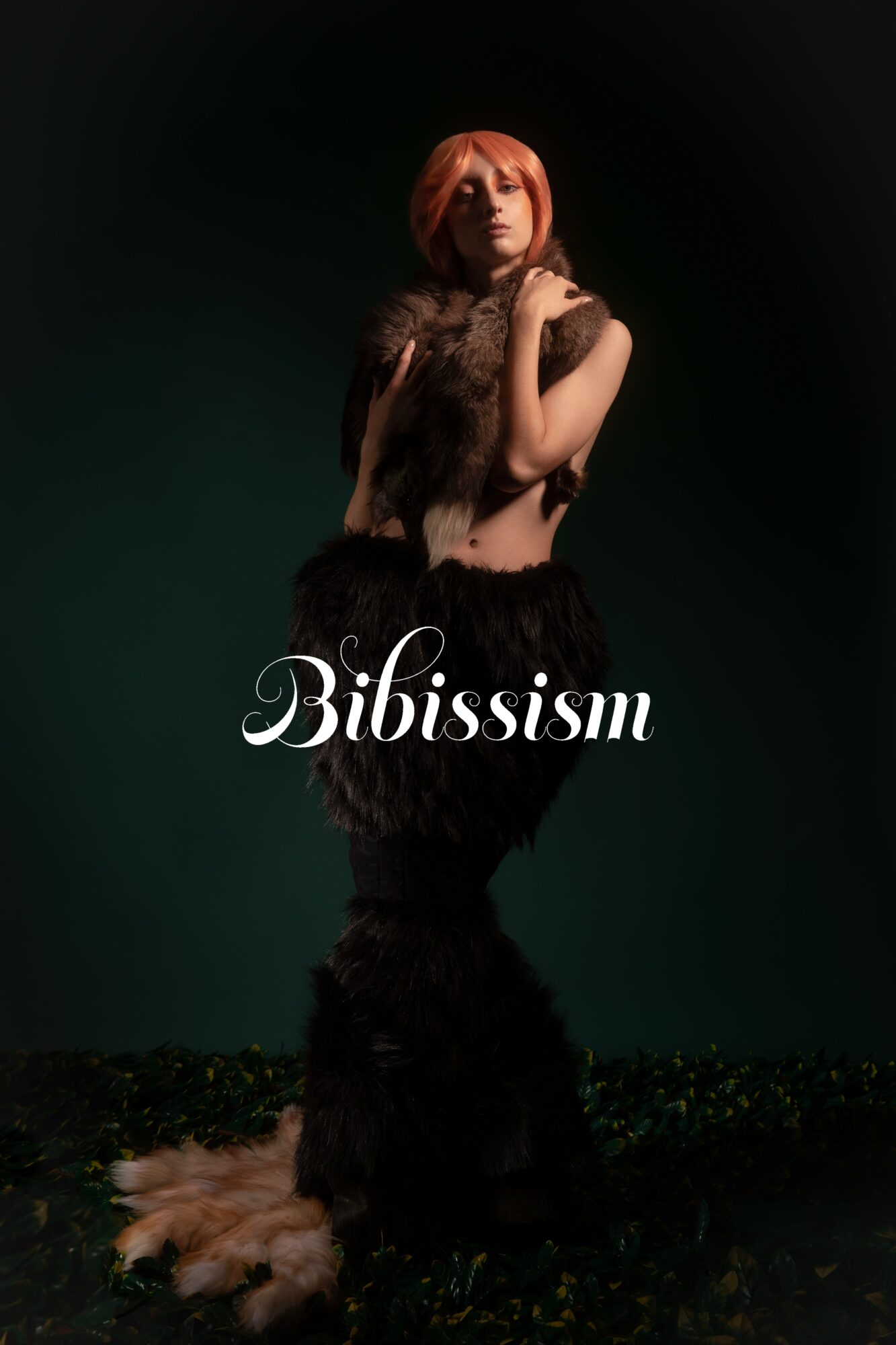 A woman with orange hair in a dark outfit stands against a dark background, with the word 'Bibissism' written across.