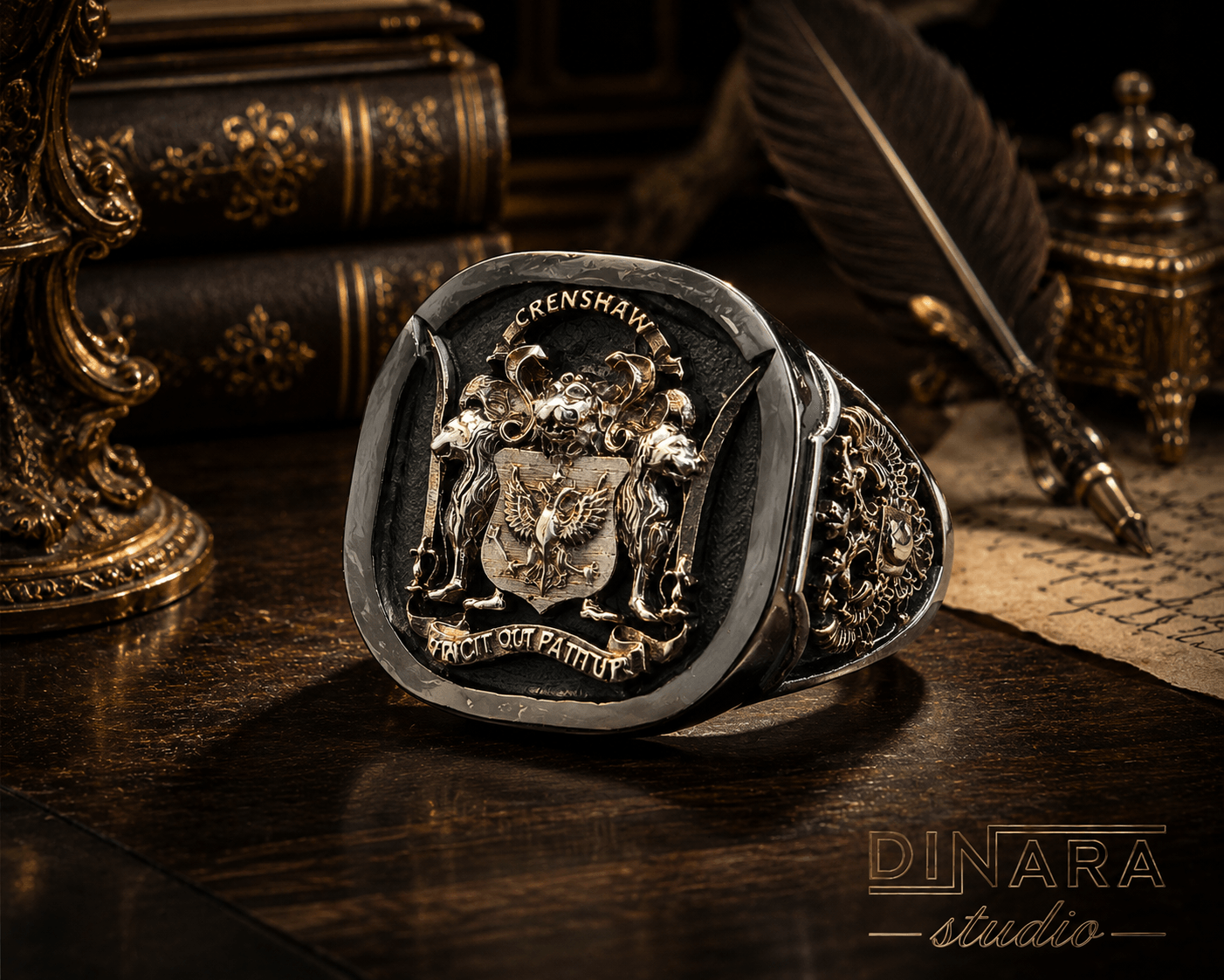 A silver ring with a crest and Latin inscription, placed on a dark wooden surface with vintage objects around.