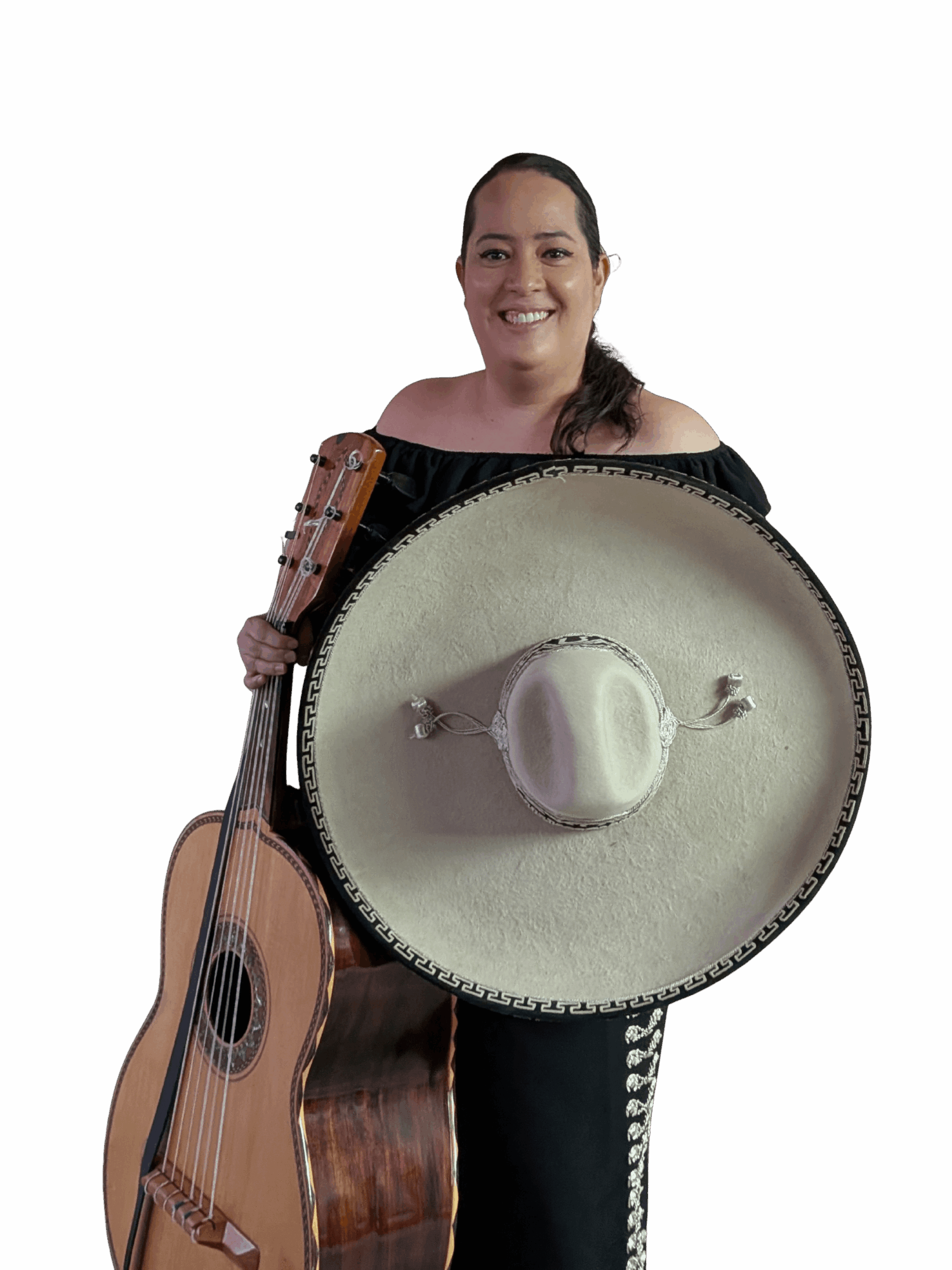 Woman holding a guitar and a large sombrero, smiling, against a black background.